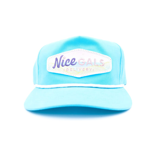 front view of nice gals hat with logo by tommy breeze in teal and pink color